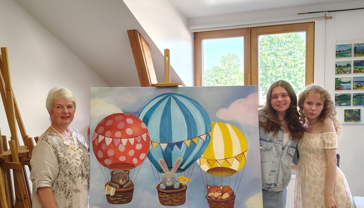 Skolotāja un audzēknes pie gleznas